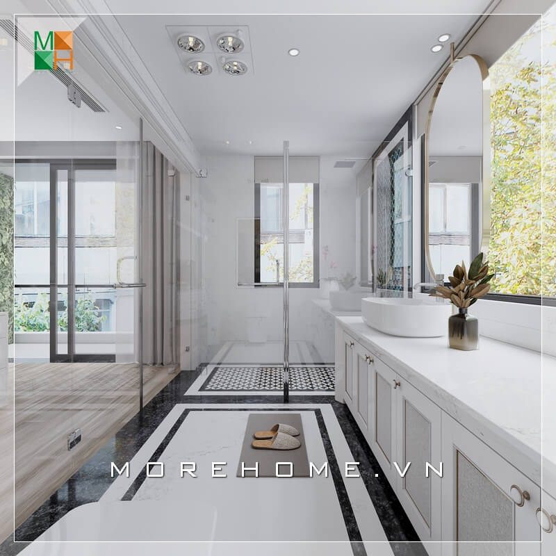 . Mẫu phòng tắm hiện đại dành cho nhà phố, chung cư, biệt thự bao gồm mặt tủ và lavabo làm từ đá nhân tạo kết hợp với gỗ công nghiệp chống ẩm, mang lại cảm giác trẻ trung cho không gian phòng tắm. Vách kính cường lực trong suốt cũng đóng vai trò quan trọng trong việc tạo nên sự liền mạch trong không gian.